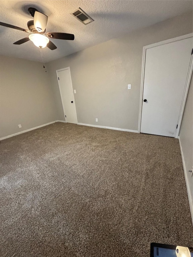 105 Poinciana St, Lake Jackson, TX 77566 - spare room with ceiling fan, visible vents, carpet, baseboards, and a textured ceiling