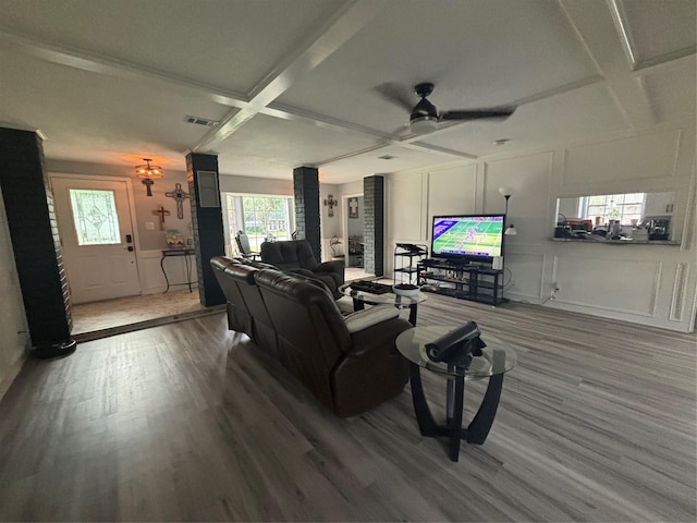 living room with ceiling fan, coffered ceiling, and hardwood / wood-style floors