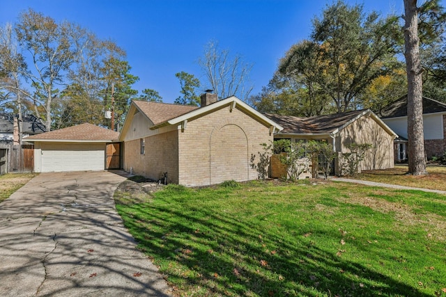 view of front of property featuring a garage and a front lawn