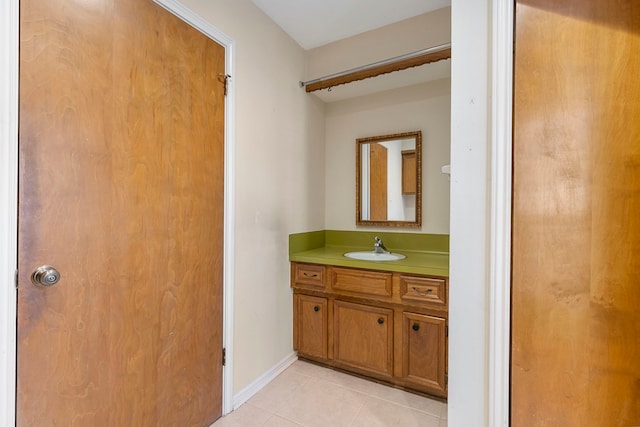 bathroom with tile patterned flooring and vanity