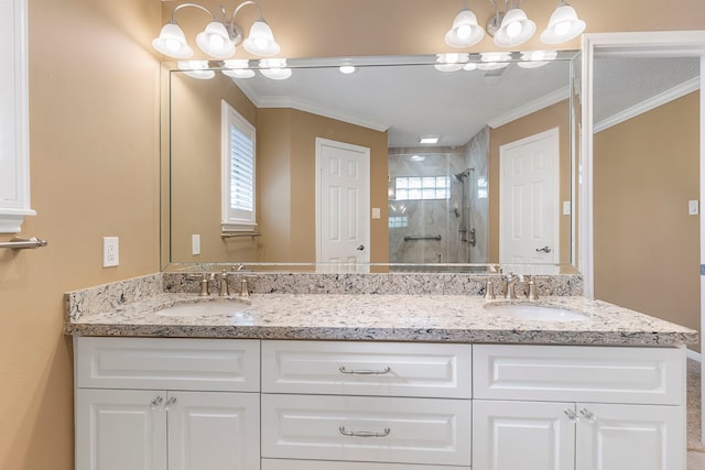 bathroom with a shower with door, crown molding, a notable chandelier, and vanity