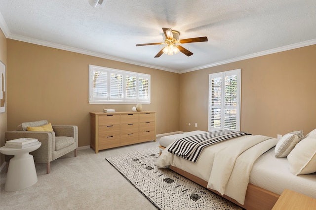 bedroom featuring ornamental molding, light colored carpet, and a textured ceiling