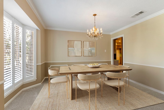 carpeted dining area with an inviting chandelier and crown molding