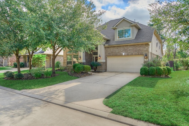 craftsman house featuring a garage and a front yard