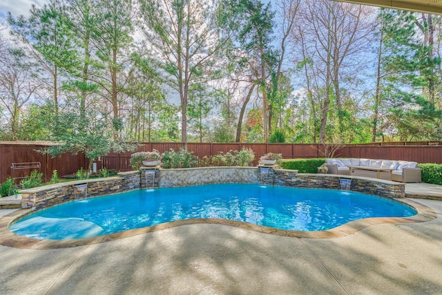 view of pool with a patio, an outdoor hangout area, and pool water feature