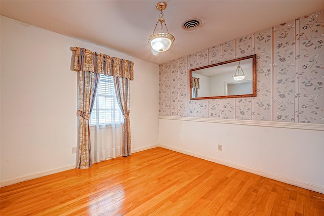 empty room with wood-type flooring