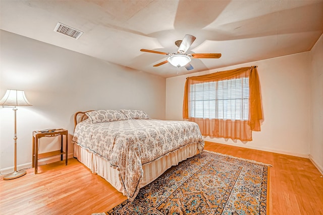 bedroom featuring ceiling fan and light hardwood / wood-style flooring