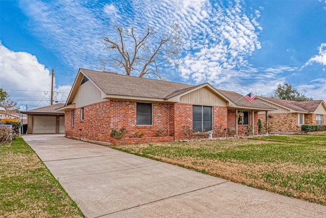 ranch-style home featuring a garage and a front lawn