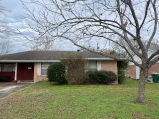 ranch-style house with a front lawn