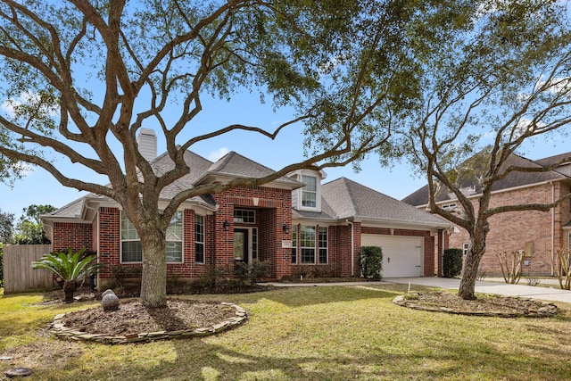 view of front of property featuring a garage and a front yard