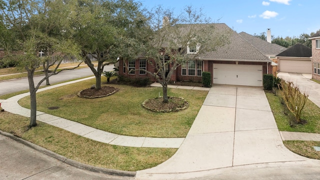 view of front of home with a garage and a front lawn