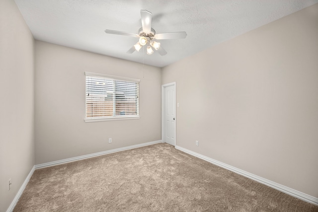 unfurnished room with light carpet, a textured ceiling, and ceiling fan