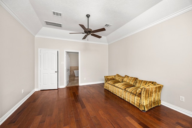 living area with ceiling fan, ornamental molding, a textured ceiling, and dark hardwood / wood-style flooring