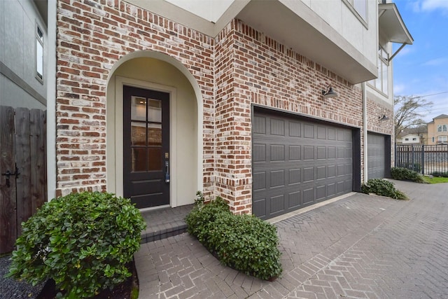 entrance to property featuring a garage