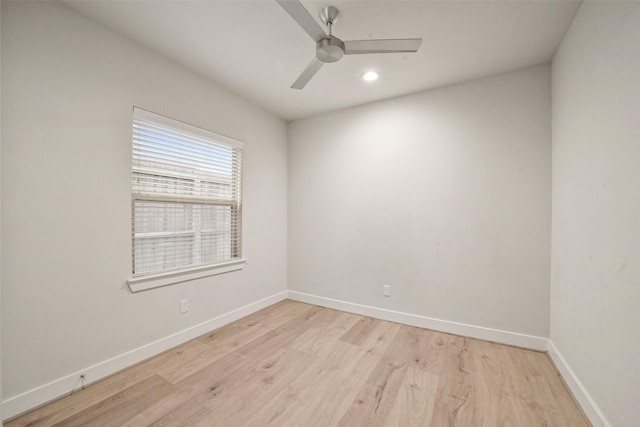 unfurnished room with ceiling fan and light wood-type flooring