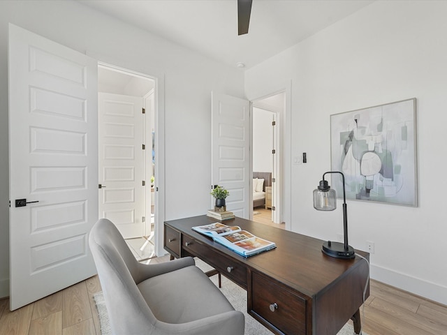 office space with light hardwood / wood-style flooring and ceiling fan