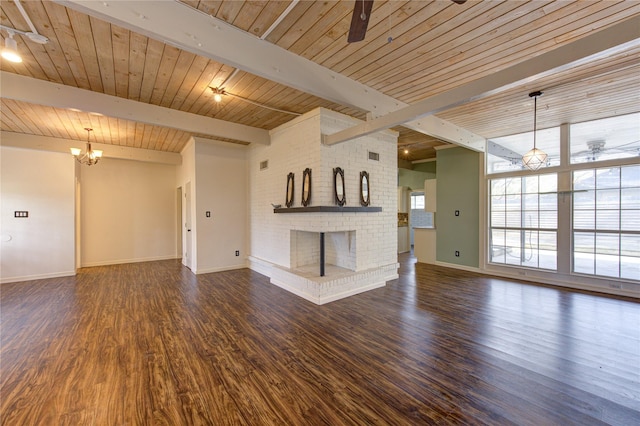 unfurnished living room with beamed ceiling, dark hardwood / wood-style floors, ceiling fan with notable chandelier, and a fireplace