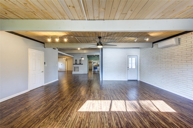 unfurnished living room featuring wood ceiling, beam ceiling, dark hardwood / wood-style floors, a wall mounted AC, and brick wall