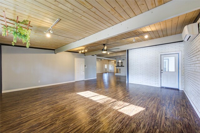 unfurnished living room featuring wood ceiling, dark wood-type flooring, rail lighting, and brick wall