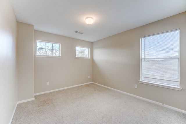 view of carpeted spare room