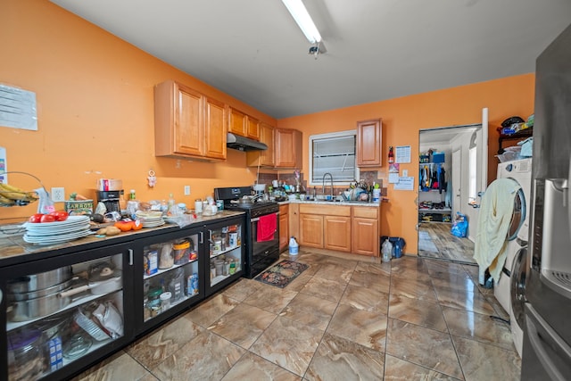 kitchen featuring sink and black range with electric cooktop