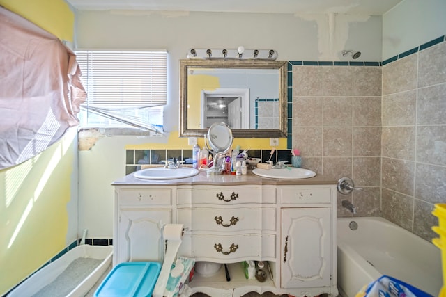 bathroom featuring vanity and a tub to relax in