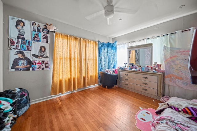 bedroom featuring ceiling fan and light hardwood / wood-style floors