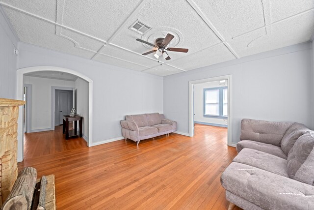 living room featuring hardwood / wood-style flooring and ceiling fan