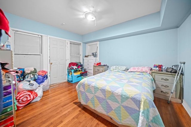 bedroom featuring ceiling fan and light hardwood / wood-style flooring