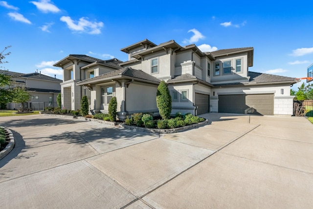 prairie-style house featuring a garage