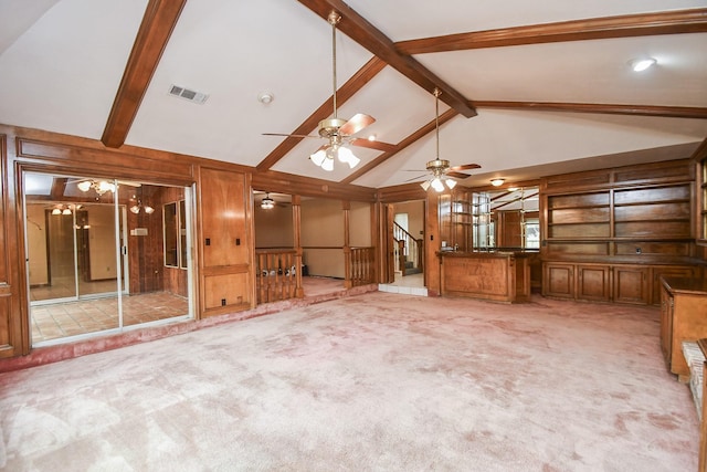 interior space featuring high vaulted ceiling, wooden walls, beam ceiling, and light carpet