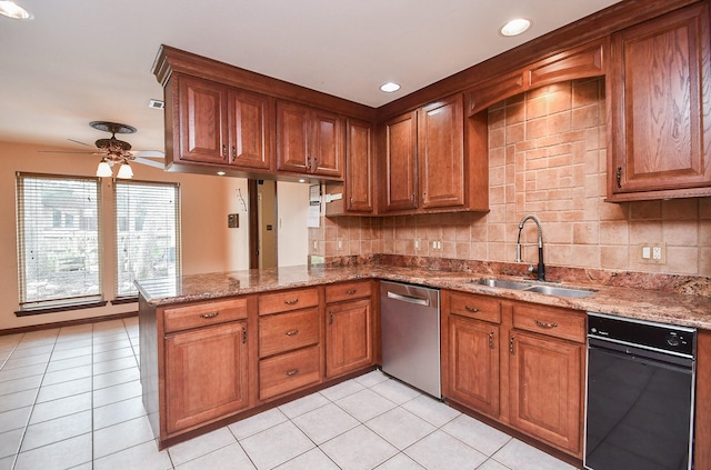 kitchen featuring dishwasher, sink, light tile patterned floors, and kitchen peninsula