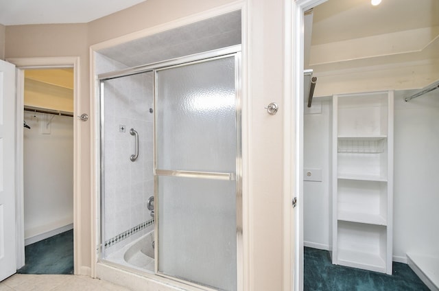 bathroom with a shower with shower door