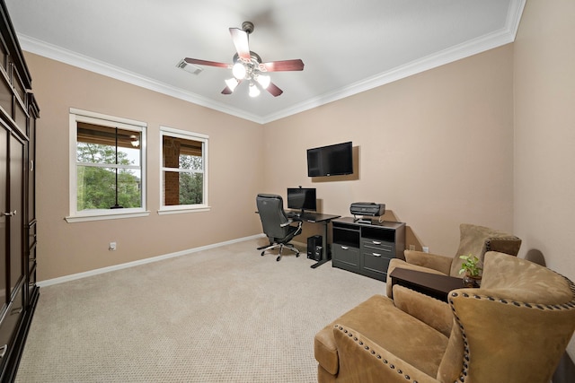 home office featuring baseboards, visible vents, a ceiling fan, light colored carpet, and crown molding