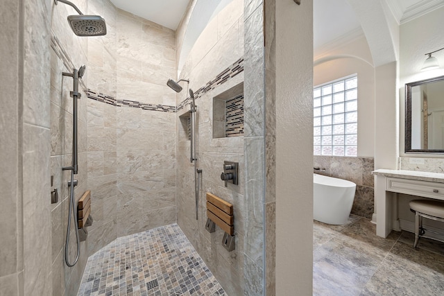 full bath with tile walls, ornamental molding, a tile shower, and a freestanding bath