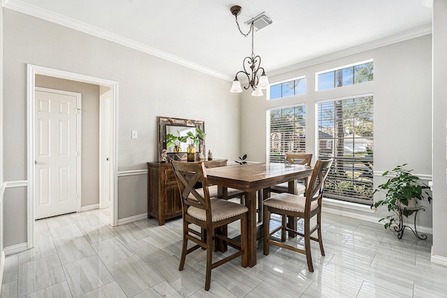 dining room featuring baseboards, visible vents, ornamental molding, and a notable chandelier