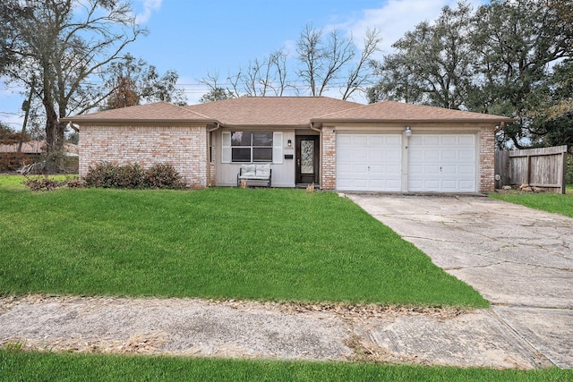 ranch-style home featuring a garage and a front lawn