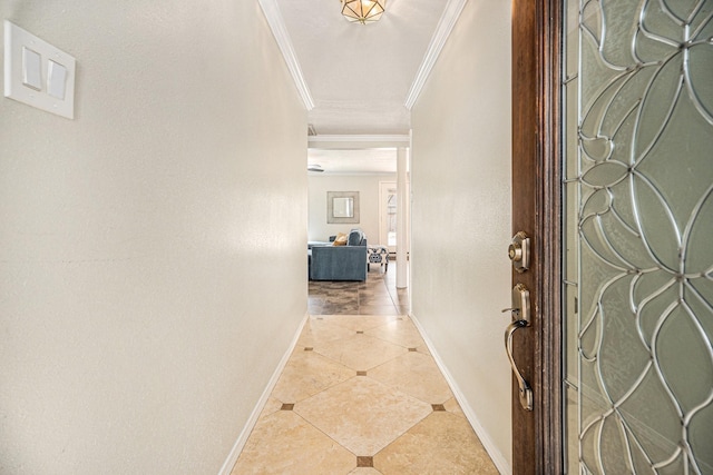 entrance foyer featuring crown molding and tile patterned flooring