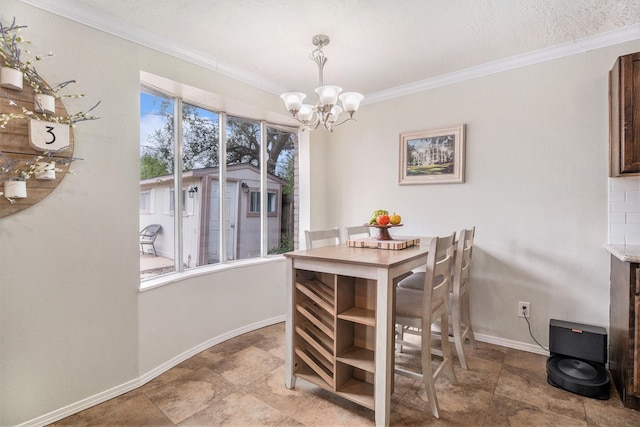 dining space with a notable chandelier and ornamental molding