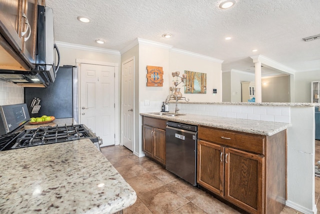 kitchen featuring sink, crown molding, appliances with stainless steel finishes, tasteful backsplash, and light stone countertops