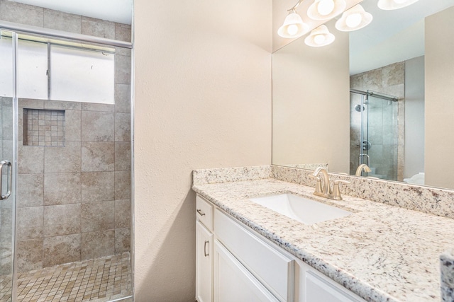 bathroom featuring vanity and walk in shower