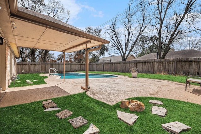 view of swimming pool featuring a patio and a lawn