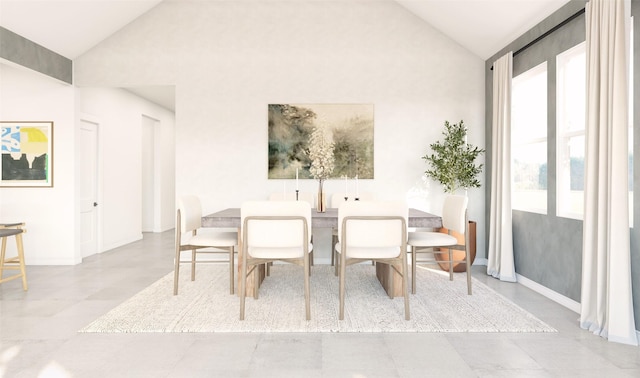 dining area with high vaulted ceiling