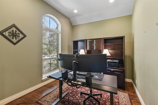 home office featuring dark hardwood / wood-style flooring and lofted ceiling