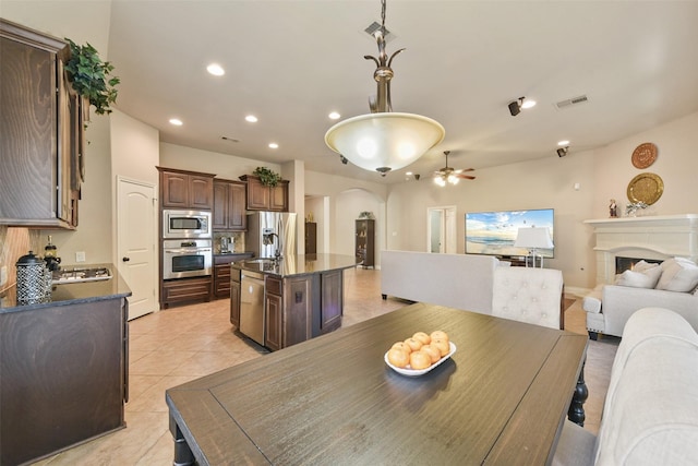 dining room featuring light tile patterned floors and ceiling fan