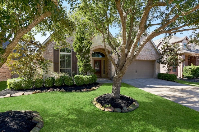 view of front facade with a garage and a front yard