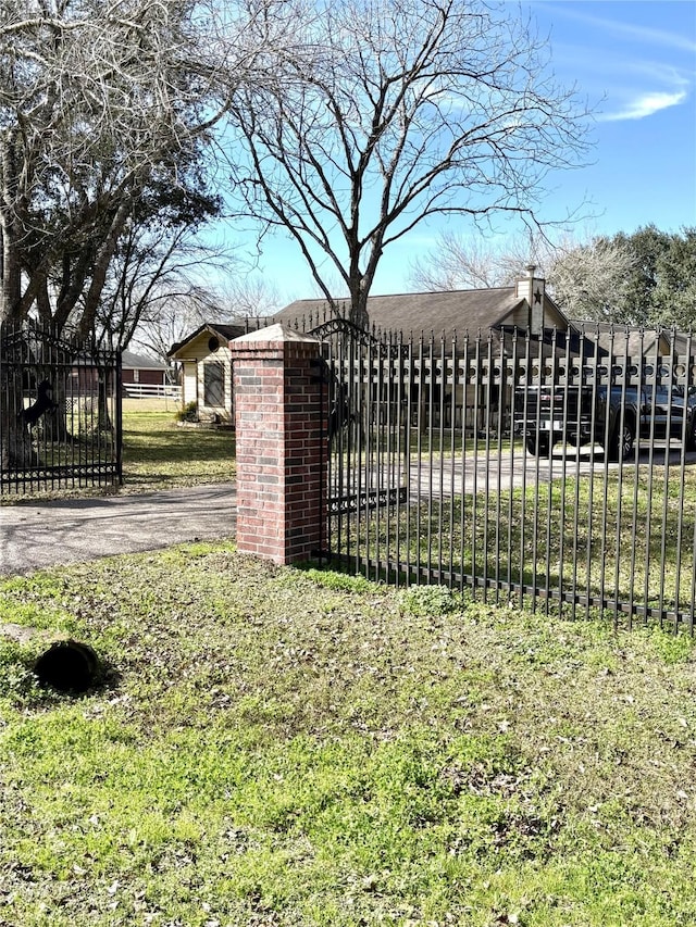 view of gate featuring fence