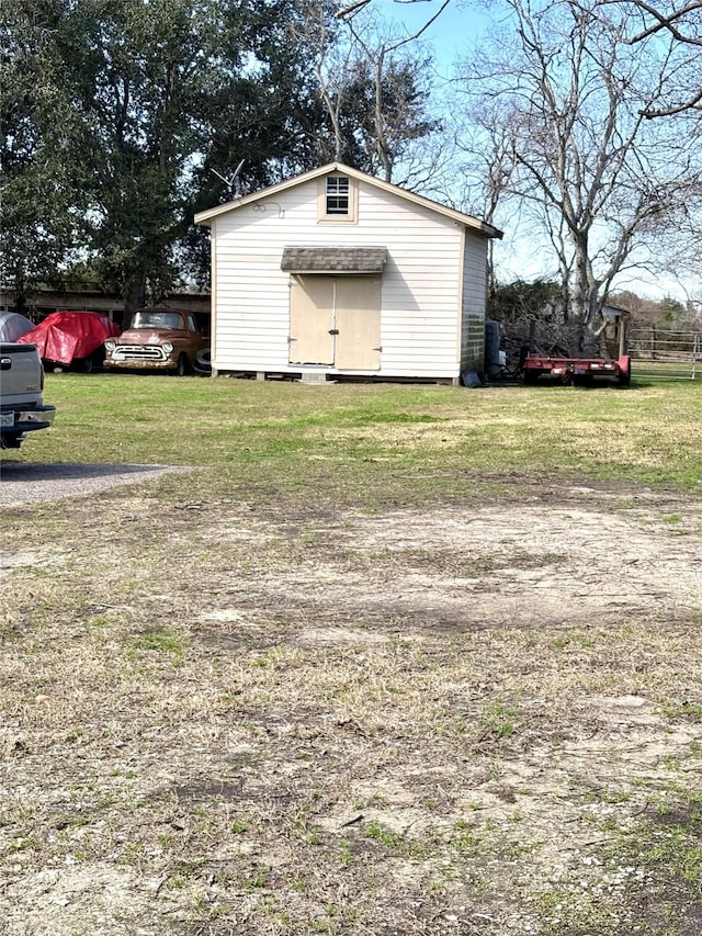 view of outdoor structure with a yard