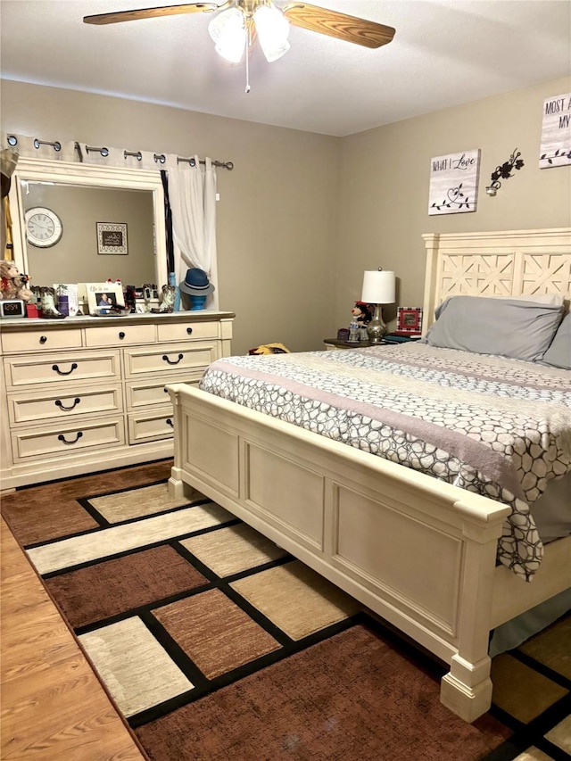 bedroom featuring hardwood / wood-style flooring and ceiling fan