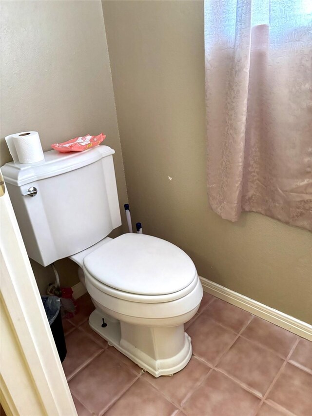 bathroom featuring tile patterned floors and toilet